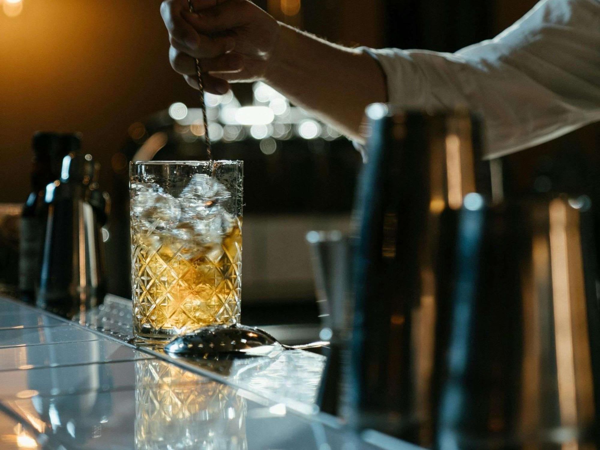 Sofitel Bahrain Zallaq Thalassa Sea & Spa Manama Exterior photo A bartender adding ice to a glass